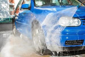 Blue car in a car wash photo