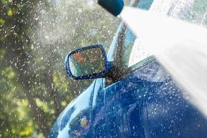 Blue car in a car wash photo