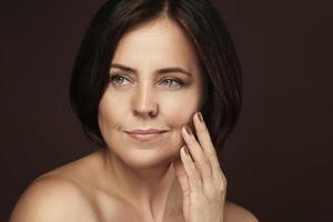 Beautiful middle aged woman with clean wrinkled skin photo