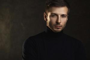 Young handsome man wearing a polo neck photo