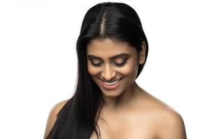 Beautiful Indian woman with smooth skin and long black hair photo