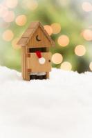 Santa in An Outhouse on Snow Over and Abstract Background photo