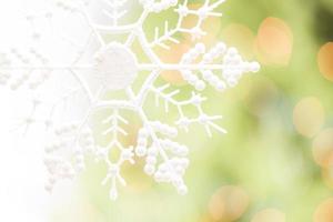 Snowflake Over an Abstract Green and Gold Background photo