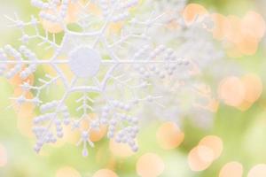 Snowflake Over an Abstract Green and Gold Background photo