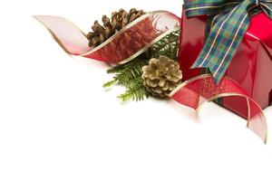 Christmas Present with Ribbon, Pine Cones and Pine Branches on White photo