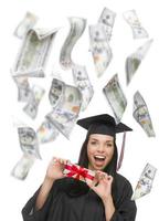 Female Graduate Holding 100 Bills with Many Falling Around Her photo