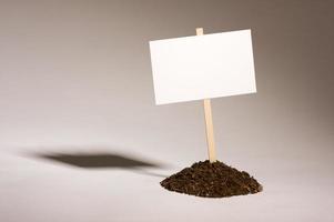 Blank White Sign in Dirt Pile photo