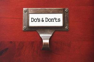 Lustrous Wooden Cabinet with Do's and Don'ts File Label photo