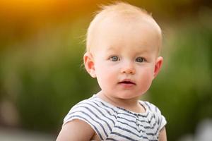 Adorable Infant Girl Child Portrait Outdoors photo