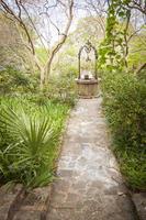 Beautiful Lush Park Walkway and Antique Well photo