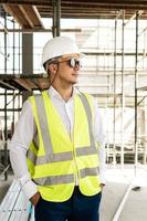 Architect wearing safety vest on a construction site photo