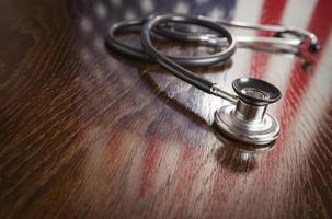Stethoscope with American Flag Reflection on Table photo