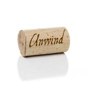 Unwind Branded Wine Cork on White photo