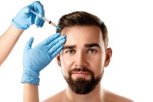 Handsome man receiving facial injection for skin rejuvenation photo