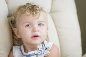 Adorable Blonde Haired and Blue Eyed Little Girl in Chair photo