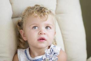 Adorable Blonde Haired and Blue Eyed Little Girl in Chair photo