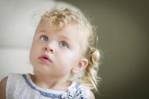 Adorable Blonde Haired and Blue Eyed Little Girl in Chair photo