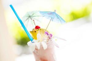 Fruity Tropical Drink with Pineapple and Umbrullas photo