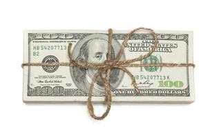 Stack of One Hundred Dollar Bills Tied in a Burlap String on White photo