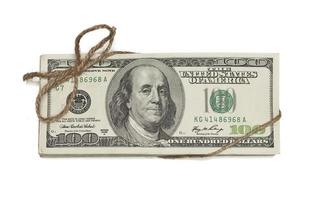 Stack of One Hundred Dollar Bills Tied in a Burlap String on White photo