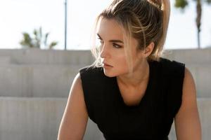 Young athletic woman during summer street workout photo