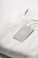 Paper label on a white 100 percent organic cotton clothing photo