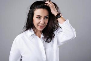 Portrait of beautiful middle aged woman wearing white shirt photo