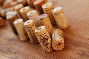 Wine corks on wooden table photo