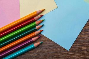 Colorful pencils and memo stickers photo