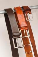 Leather belts hanging photo