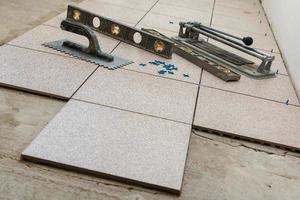 Installation of floor tiles