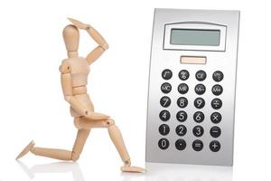 Small wooden dummy and calculator photo