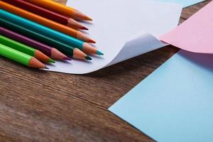 Colorful pencils and memo stickers photo