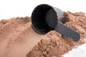 Closeup of scoop with a chocolate protein powder photo