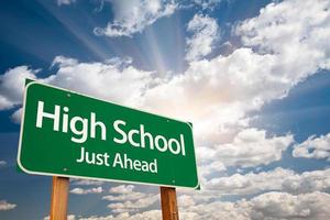 High School Green Road Sign Over Clouds photo