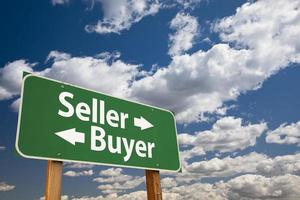 Seller, Buyer Green Road Sign Over Clouds photo