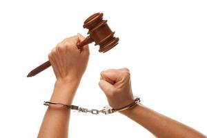 Handcuffed Woman Holding Wooden Gavel on White photo