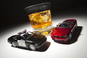 Police and Sports Car Next to Alcoholic Drink photo