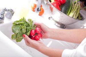 Woman Washing Radish photo