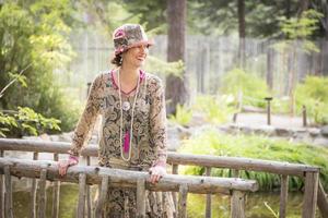 1920s Dressed Girl On Wooden Bridge Portrait photo