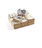 Small House on Stacks of Hundred Dollar Bills Isolated on a White Background photo