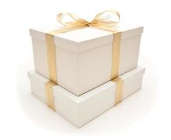 Stacked White Gift Boxes with Gold Ribbon Isolated photo