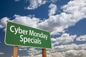 Cyber Monday Specials Green Road Sign and Clouds photo