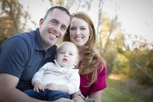 Young Attractive Parents and Child Portrait Outside photo