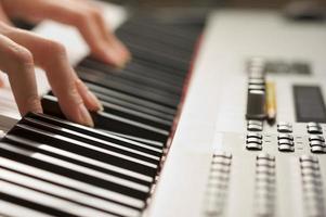 Woman's Fingers on Digital Piano Keys photo