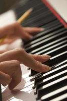 Woman's Fingers on Digital Piano Keys photo