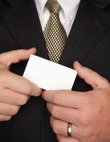 Businessman Holding Blank Business Card photo