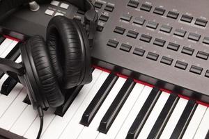 Headphones Laying on Electronic Keyboard photo