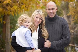 Young Attractive Parents and Child Portrait in Park photo