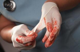 Abstract of Doctors Bloody Surgical Gloves photo